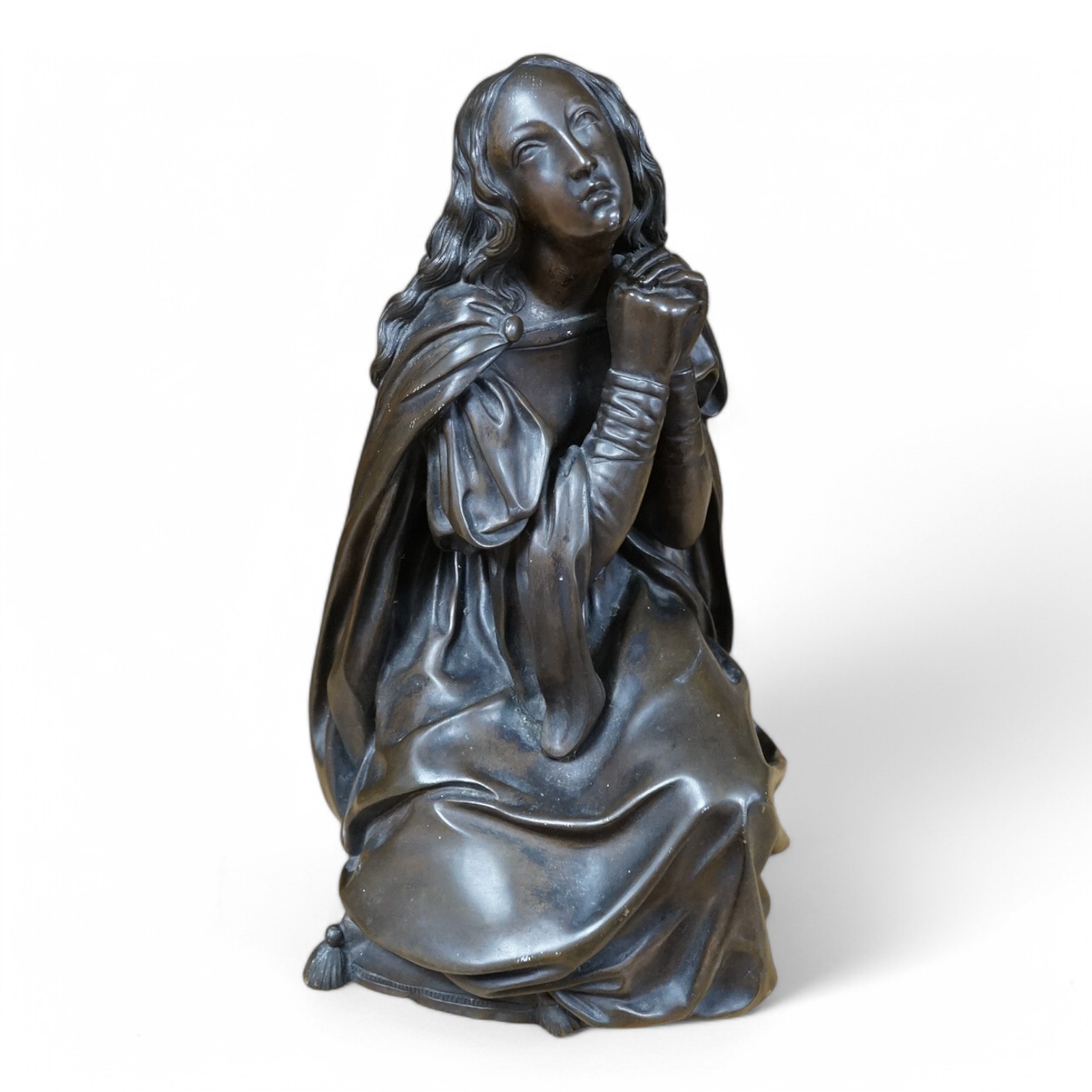 An early to mid 20th century bronze figure of Mary Magdalene kneeling, 20cm. Condition - good